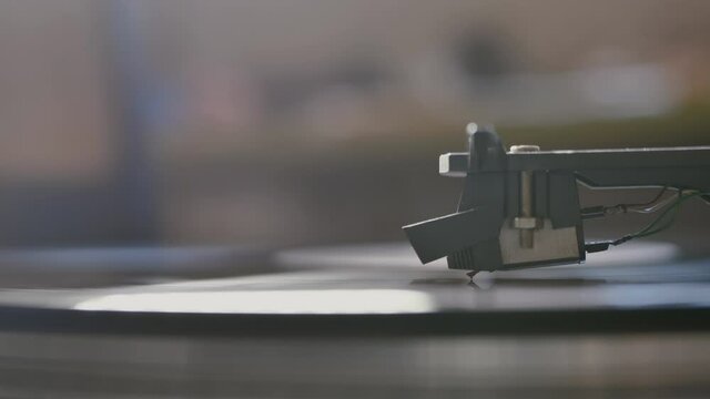 Cinemagraph vinyl record is spinning. Old retro turntable.turntable stylus on a record