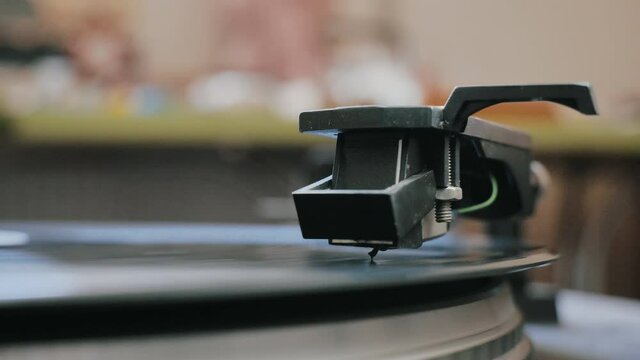 Cinemagraph vinyl record is spinning. Old retro turntable.turntable stylus on a record