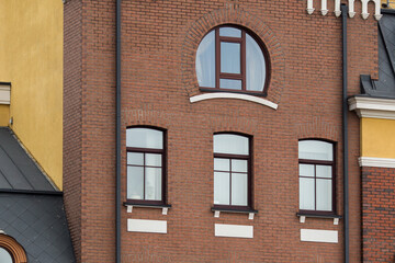 Obraz premium A close-up of the facade of a brick house in an antique brown color.