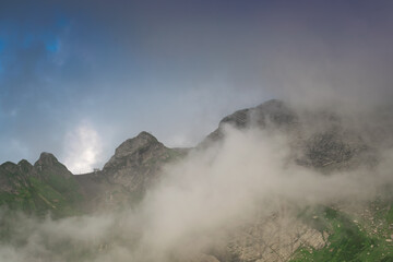 Cloudy slopes and mountain peaks, beautiful landscape