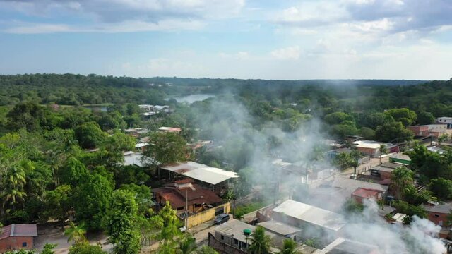 Aerial - Impoverished indigenous slum near the city of Manaus, Brazil. Wide shot, pull back. 