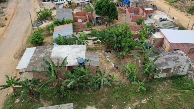 Aerial flyover shot of an impoverished indigenous slum in Manaus, Brazil. 