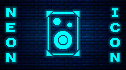 Glowing neon Stereo speaker icon isolated on brick wall background. Sound system speakers. Music icon. Musical column speaker bass equipment. Vector.