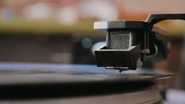 Cinemagraph vinyl record is spinning. Old retro turntable.turntable stylus on a record