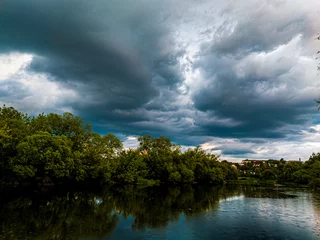 Foto op Canvas clouds over the river © Hyperion88