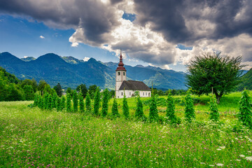 Church with agricultural sourrounding in the slovenian alpine area.