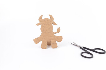 Step by step instructions for creating a paper cow or bull, Children art project. DIY concept. cardboard craft. Step 2