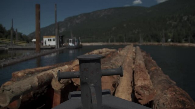 POV Bow of Ship Pushing Log Boom in Water