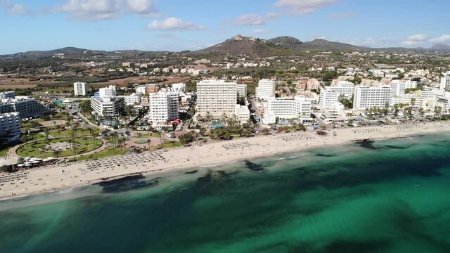 Cala Millor Beachfront. Resort City on Mallorca Island, Spain. Drone Aerial View of  Sandy Beach and Mediterranean Sea on Sunny Summer Day