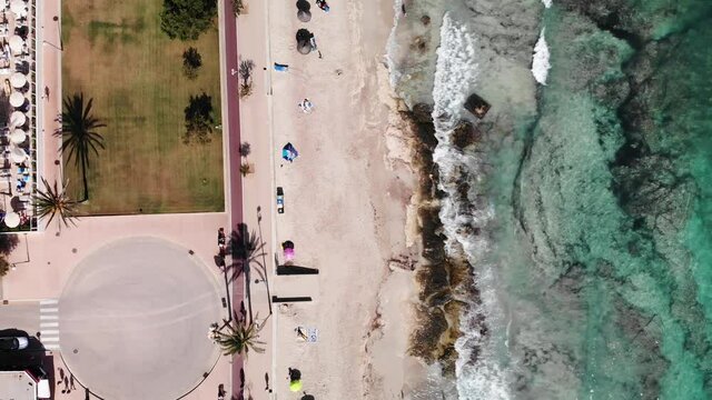 Top Down Aerial View of Beach and Promenade in Cala Millor Mallorca Island Spain . Popular Tourist and Holiday Destination in Mediterranean Sea, Drone Shot