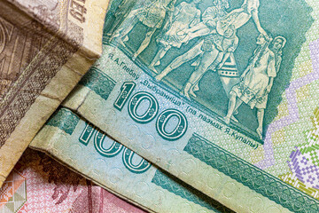 Belarusian old bills of 100 rubles lie together