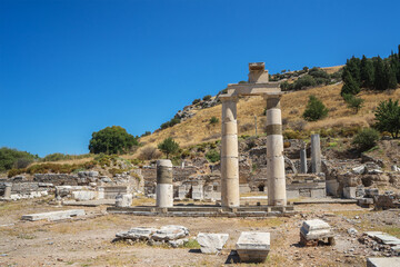 Fototapeta na wymiar Ruins in the ancient Greek city Ephesus or Efes on the coast of Ionia in Izmir Province, Turkey in summer day.