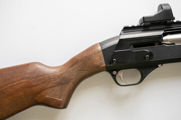 close up macro of the hunter rifle gun detail, classic elegant wooden and metal