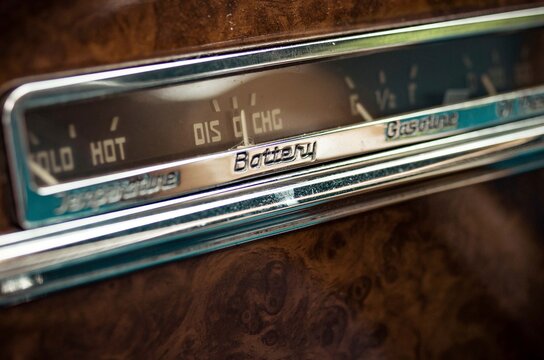 Interior Detail Of Luxury, Vintage, Classic Car Dashboard Radio With Chrome And Fine Wooden Panelling