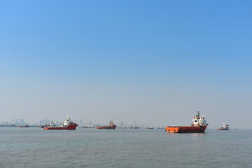Boats are floating all around this vast blue ocean