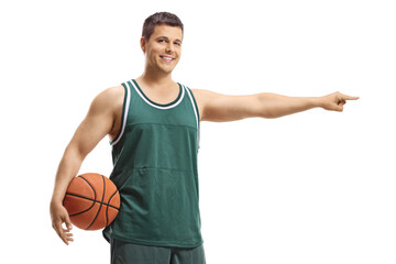 Basketball player in a jersey holding a ball and pointing to one side