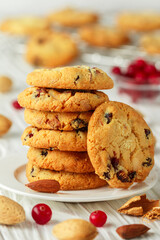 Freshly baked homemade Christmas cookies with cranberries, almonds and white chocolate. Delicious festive biscuit. Gingerbreads. Selective focus