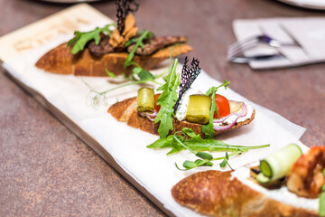 Fresh salad on bruschetta . Restaurant food concept