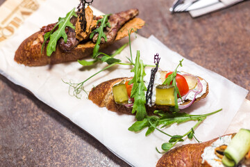 Fresh salad on bruschetta . Restaurant food concept