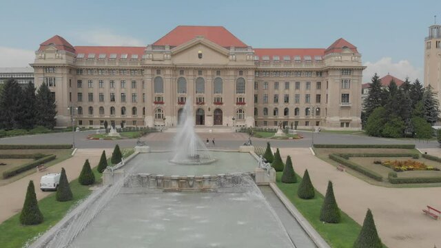 Aerial / drone footage of the University of Debrecen / Debreceni Egyetem in Debrecen, second largest city and a major cultural center of Hungary, located in the Northern Great Plain region
