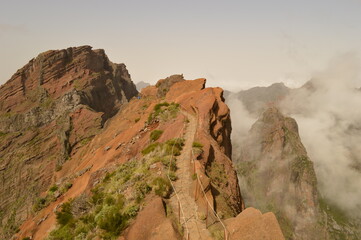 Hiking on the mountain ridge of Madeira Island on the way to Pico Ruivo, Portugal