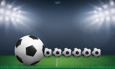 Naklejka premium Soccer football ball and green grass of soccer field stadium background. Vector.