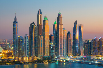 Plakat Dubai Marina skyscrapers and Jumeirah beach at sunrise, United Arab Emirates