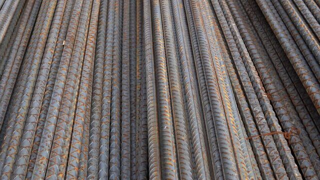 Full Frame Shot Of Stacked Metal Rods At Construction
