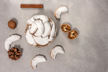 Traditional Austrian and German crescent-shaped Christmas pastries - Vanillekipferl - on a gray table