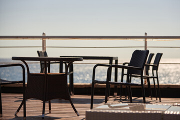 Fototapeta na wymiar Tables in a cafe by the sea, summer vacation.