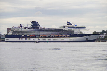Modern luxury cruiseship or cruise ship liner docked at pier and terminal in Portland, Maine during...