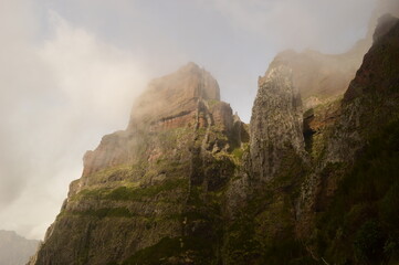 Climbing to the dramatic peak of Pico Ruivo mountain on the ridge of Madeira Island, Portugal