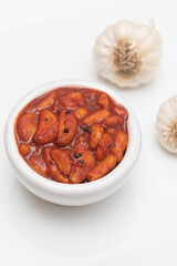Home made sour hot and spicy garlic or Lehsun pickle,  Kerala South India made using red chilli and Indian spices. Its cloves are used for consumption raw or cooked or for medicinal purposes