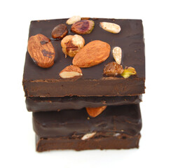 Chocolate with almonds , peanuts on white background