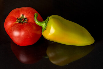 red tomato and yellow peppers