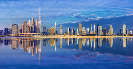 View on Dubai skyline with reflection at the sunrise, Dubai, United Arab Emirates 