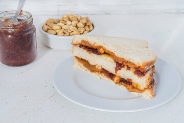 Peanut butter with bread and raspberry marmalade