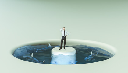Businessman surrounded by water and sharks