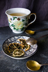 Obraz na płótnie Canvas Set of tea, vintage silver spoons, various of tea and cup of tea