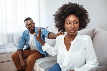 Couple Having Argument - Conflict, Bad Relationships. Unhappy Couple After an Argument in the Living Room at Home. Making Decision of Breaking Up Get Divorced - obrazy, fototapety, plakaty