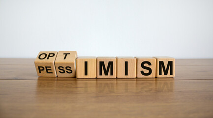 Turned a cube and changed the expression 'pessimism' to 'optimism'. Beautiful wooden table, white...