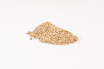 Powdered black ground pepper pile from top on white background