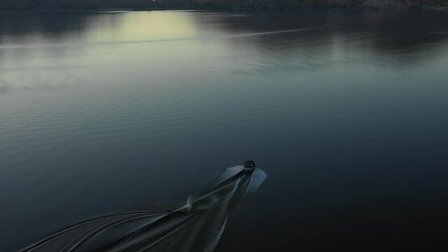 A water skier over a smooth lake #1