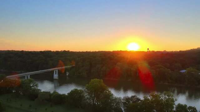 Vivid sunset with clear sky showing Cunningham Bridge crossing Cumberland river