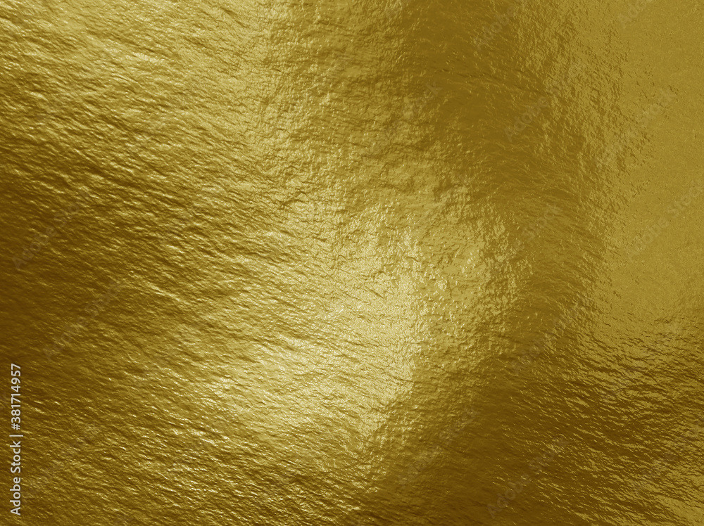 Wall mural Gold foil background with highlights and uneven texture