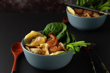 Shrimp noodle soup with wontons and spinach
