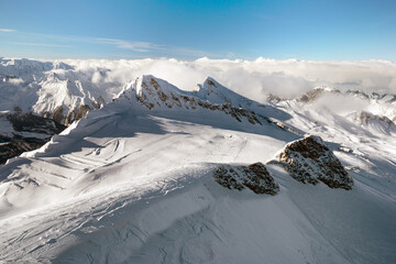 Fototapeta na wymiar Winter view from the top of Ausrtian Alps in Kaprun ski resort, National Park Hohe Tauern, Europe, Austria 