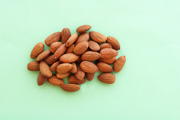 fresh almonds on color background