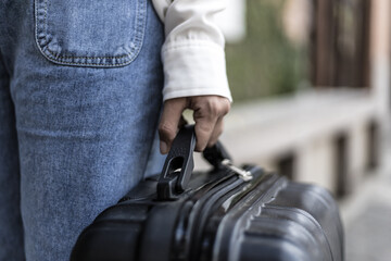 Asian woman carrying a big black bag to travel during the vacation of the year, Trolley bag, Long weekend travel, Love the trip, Tourism festival concept.