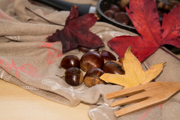 chestnuts in the pan to be roasted in autumn